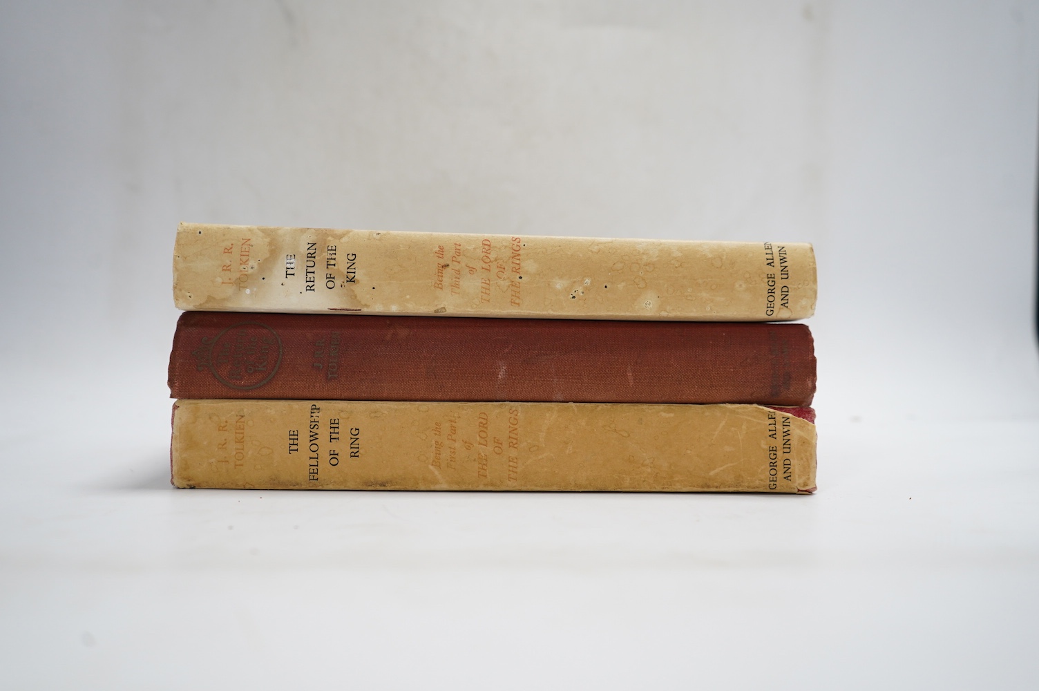 Tolkien, J.J.R - Lord of the Rings, 3 vols, to consist of The Fellowship of the Rings, first edition, 14th. impression, original cloth, folding map at rear, unclipped dust-jacket, with browned spine and closed tear to 4c